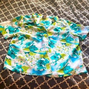 Hawaiian shirt: aqua and green flowers/leaves on white background. Gently used.